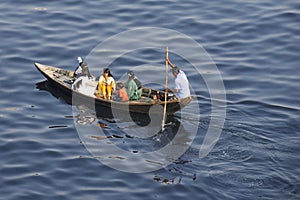 Residents of Dhaka cross Buriganga river by boat in Dhaka, Bangladesh.